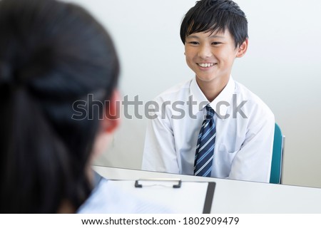 Junior high school students are having an interview Royalty-Free Stock Photo #1802909479