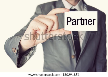 I love business. Businessman in suit with a black tie showing or holding business card in retro vintage style