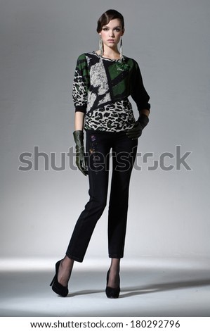 Full body beautiful girl is in fashion style on gray background