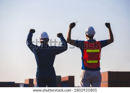Silhouette of Business engineer man celebration success happiness on container box, Teamwork Concept