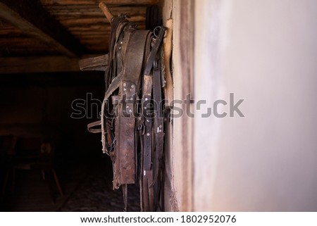 Old horse collar hanging in the stable
