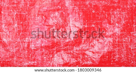 Abstract red, pink and coral colors background for design.Crumpled plastic bag.
