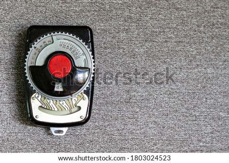 Old vintage Soviet retro exposure meter (a device for measuring photographic exposure and determining the correct shutter speed and aperture) with copy space.