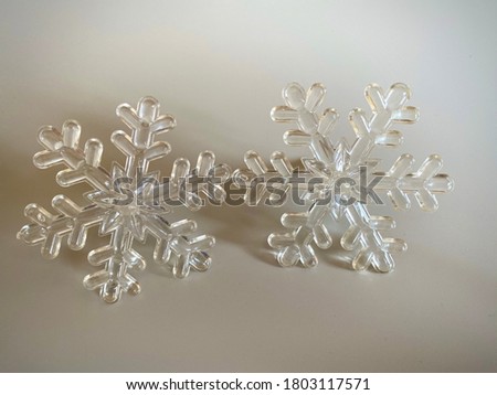 Two glass snowflakes on white background. Copy space. Christmas Card concept.  New year Card concept. Winter concept.