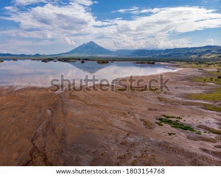 Aerial view on a Picturesque Coastline of Lake Natron in the Great Rift Valley, between Kenya and Tanzania. In the dry season the lake is 80% covered by soda and is known for its wading birds and huge