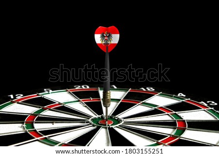The flag of Austria is featured on the dart board game, the concept of achieving goals.