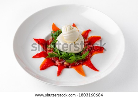 Salad with fresh herbs, baked peppers and burrata cheese. Banquet festive dishes. Gourmet restaurant menu. White background.