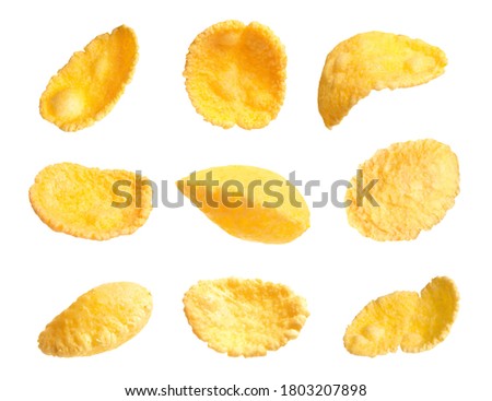 Set of tasty crispy corn flakes on white background Royalty-Free Stock Photo #1803207898