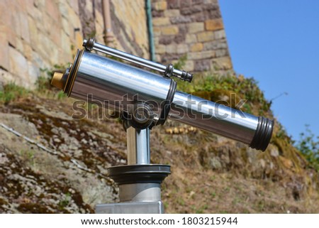 Touristic monocular stationary telescope made of shiny polished steel Royalty-Free Stock Photo #1803215944