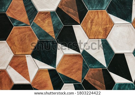 Vintage hexagonal mosaic  tiles for texture background. Green yellow brown black and white colors tiles.