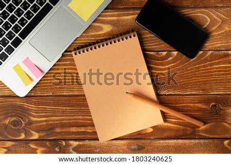Open laptop with blank notebook, view from above. Workplace concept