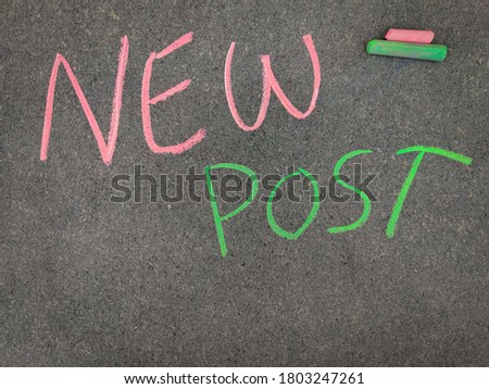 The inscription text on the grey board,NEW POST. Using color chalk pieces. Post corona concept