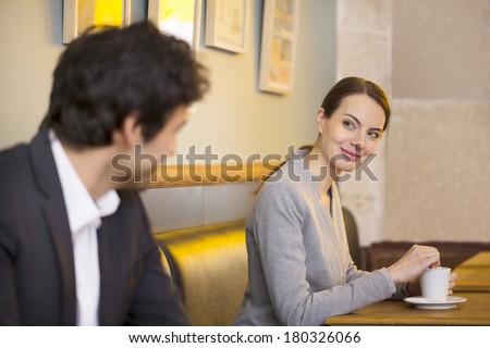 Cute Woman flirting with a man In Bar, restaurant Royalty-Free Stock Photo #180326066