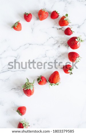 Whole Red Ripe Strawberries on Marble