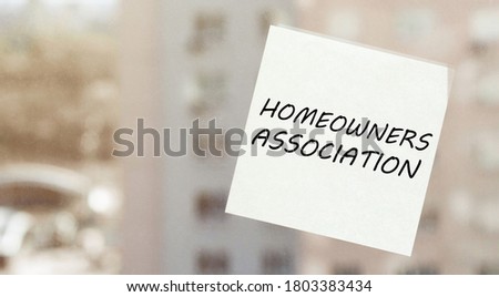 white paper with text Homeowners Association on the window
