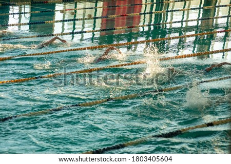 Photo of water splash in swimming pool. Water splashing.