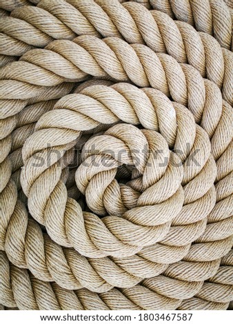 Super close up of a thick rope in shape of a spiral Royalty-Free Stock Photo #1803467587