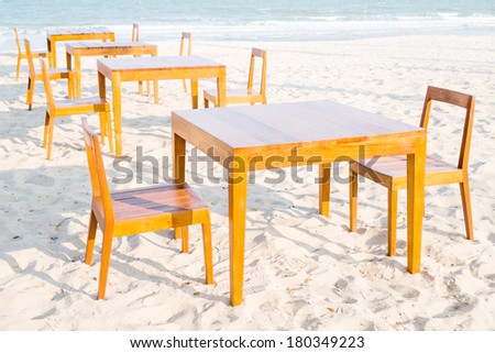 Wooden dining tables on the beach