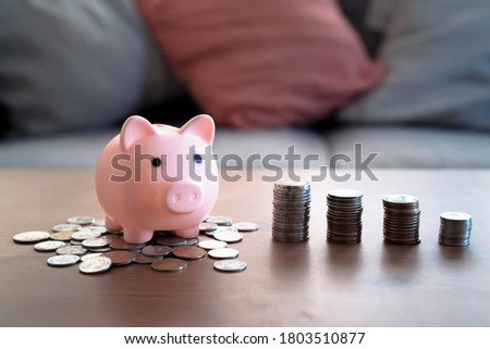 Stack of coins and piggy bank, Saving money concept.