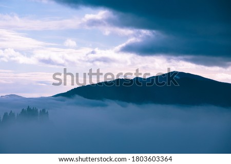 landscape of morning mountains sunrise above fogy forrest
