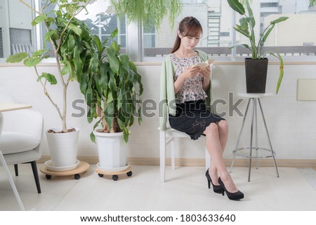 
Portrait of a woman enjoying reading by the window Royalty-Free Stock Photo #1803633640