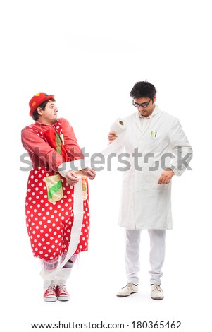 crazy doctor and a funny clown are playing with toilet paper on white background