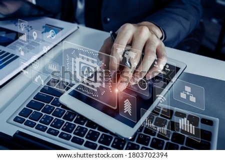 Double exposure of business hands working on tablet and laptop with digital marketing virtual chart, Abstract icon, Business strategy concept, Background toned image blurred.