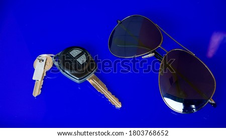 Close up of sunglasses with blue background