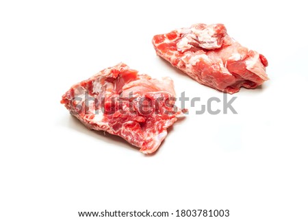 Fresh pork meat on the bone. White background. Free place.