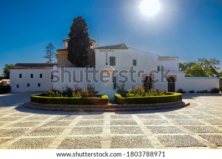 Backlighted view of Santa Maria monastery in La Rabida, with sun flares. Rabida Monastery is a Franciscan monastery in the village of Palos de la Frontera, Huelva