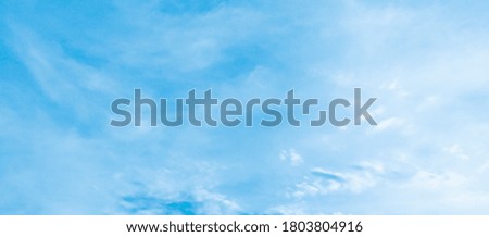 Beautiful blue sky and white clouds of various shapes with sunlight. Nature background Royalty-Free Stock Photo #1803804916