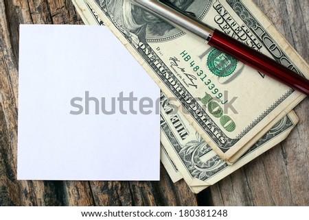 American dollars money , stick note and pen