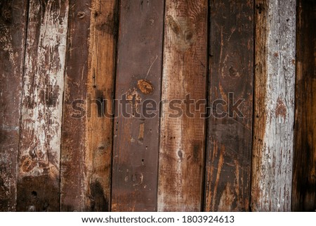 Photo backgrounds. An old scuffed fence made of brown wooden planks