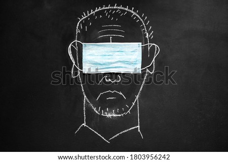 Chalkboard drawing: a man wearing a medical eye mask