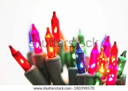 Colorful christmas lights on white background 