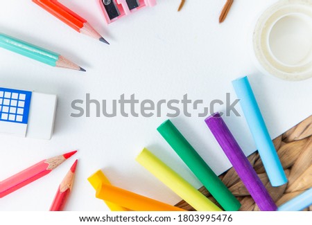 School supplies double side border. Top view isolated on a white background with copy space. Back to school concept.