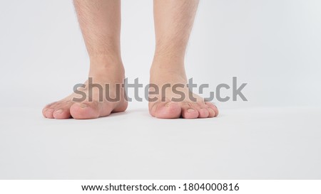 Male leg is isolated on white background