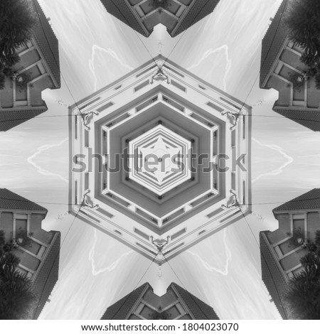 geometric symmetrical artwork in black and white with mandala or sound waves appearance. 