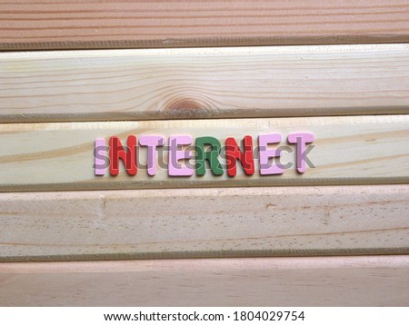 Word Internet on wood background