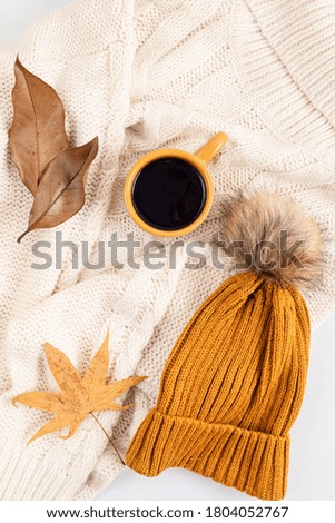 Autumn flat lay composition. Warm comfort sweater, coffee. Autumn, fall, slow living concept. Top view, copy space