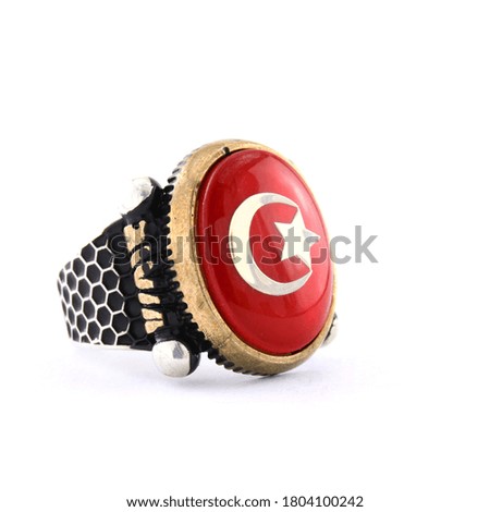 Stone-embroidered men's silver ring on a white background