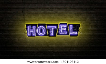 hotel sign emblem in neon style on brick wall background 