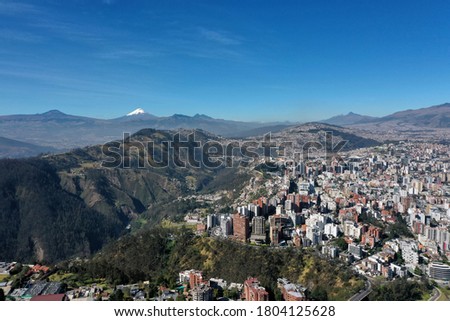Aerial view of north side of Gonzales Suarez neighborhood in Quito Ecuador. Cotopaxi volcano can be seen in the blue background Royalty-Free Stock Photo #1804125628