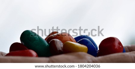 Take some  pictures by arranging some stones in the house and hand made background 