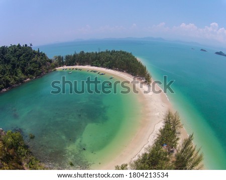 Aerial view of Beautiful island with white sand beach and clear sea at Kam Island in Ranong province, Thailand.