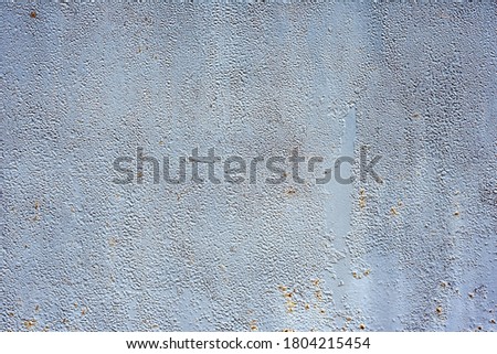 Metal texture with scratches and cracks used as a background.