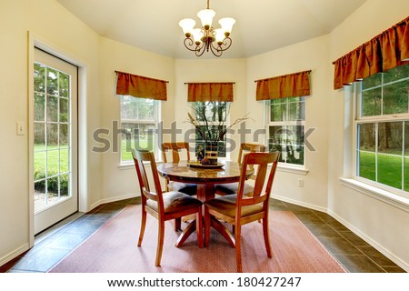 Beautiful concrete floor dining room with french windows and walkout deck