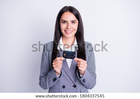 Photo of attractive professional lady good mood hold plastic debit credit card advice new banking online transfer shopping retail system service formalwear isolated grey color background