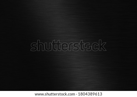 Polished black metal background. Striped abstract texture.