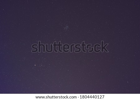Universe and Pleiades in the night sky.The Pleiades, also known as the Seven Sisters and Messier 45, are an open star cluster containing middle-aged of the constellation Taurus.